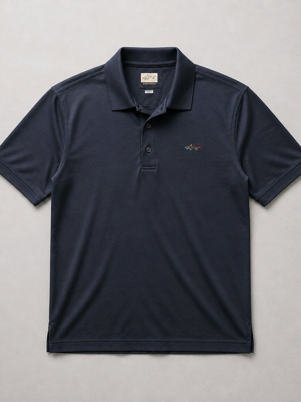 Greg Norman Collection Navy Short-Sleeve Polo with Small Multicolor Shark Logo